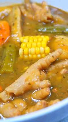 a white bowl filled with soup and vegetables