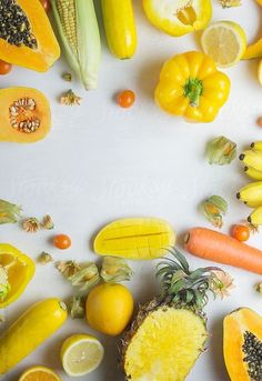 various fruits and vegetables are arranged on a white surface by jovo studio for stocks & bonds