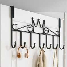 there is a coat rack with hooks on it