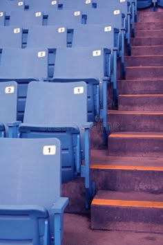 rows of blue stadium seats with numbered numbers on them royalty images, stock photos & more