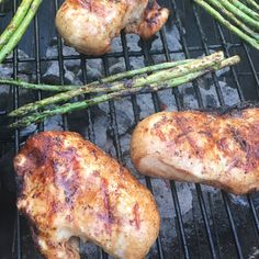 chicken and asparagus cooking on the grill