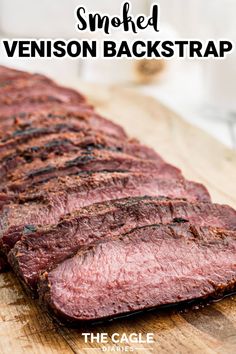 sliced venison on a wooden cutting board with text overlay saying smoked venison backstrap