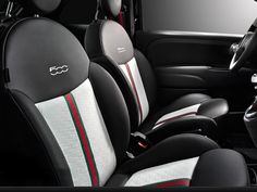 the interior of a car with black and white seats