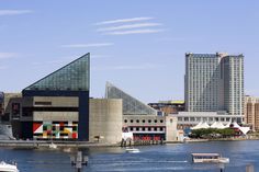 there is a boat in the water near some buildings