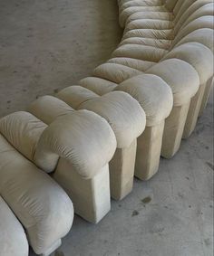 the curved couch is made out of white fabric