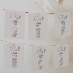 wedding seating cards hanging on a string