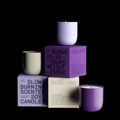 three candles are stacked on top of each other in purple and white boxes with the words burns 5 - 60 hours weight 250gr