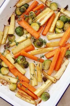 roasted vegetables and brussel sprouts in a baking dish