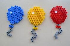 three different colored beads are attached to each other