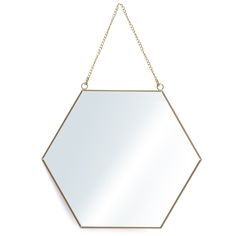 a gold hexagonal mirror hanging on a chain