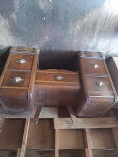 two wooden boxes sitting on top of pallets