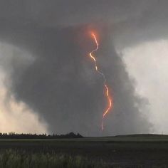 a large cloud with lightning coming out of it