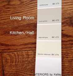 the living room is painted in white and has wood flooring options for each color