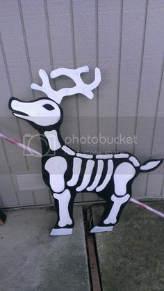 a paper cut out of a skeleton dog