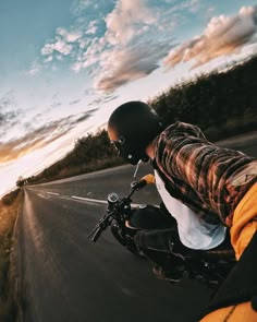 a person riding a motorcycle down a road with the caption instagram on it