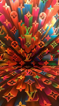 an abstract painting with multiple colors and shapes in the center, including letters that appear to be multicolored