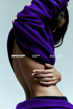 the back of a woman's body covered in purple fabric