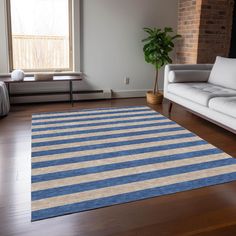 a blue and beige rug in a living room