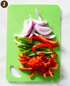 chopped red and green bell peppers on a cutting board