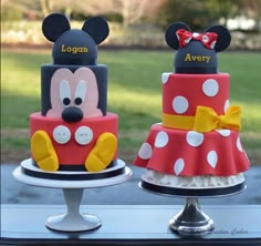 two cakes decorated to look like mickey and minnie mouse