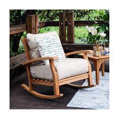 a rocking chair and table on a deck