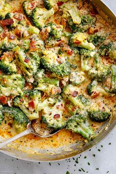 a casserole dish with broccoli and bacon in it, ready to be eaten