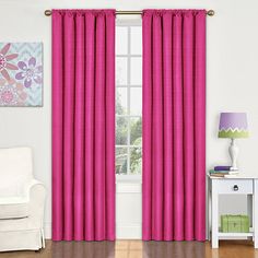 the pink curtains are hanging in front of a window