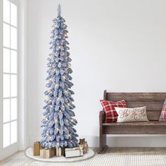 7' SNOW FLOCKED CHRISTMAS TREE: Features elegant snow-dusted blue pine needle tips that stimulate a realistic feel to deliver a touch of snowy ambiance even if a white Christmas is not on the forecast. PRE-ATTACHED CLEAR LIGHTS: Decorated with 150 UL-listed incandescent lights, which have a two-year warranty, that illuminate the home with a festive glow, eliminating the time and effort of hanging lights on your tree. SLENDER AND NATURAL APPEARANCE: Made up of 318 branch tips and gorgeous life-li Winter Wonderland Sweet 16, Wonderland Sweet 16, Christmas Tree Clear Lights, Pencil Tree, Frosted Christmas Tree, Blue Pine, Pencil Trees, Prelit Tree, Fir Christmas Tree