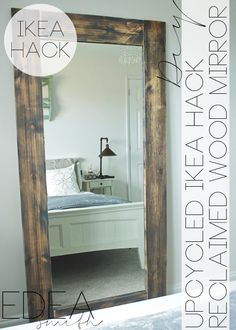 a bedroom with a bed and mirror in the corner, next to it is an ikea hack