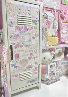 a refrigerator with hello kitty stickers on it's front and back doors, next to other items