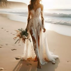 a woman standing on top of a beach next to the ocean wearing a white dress