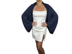 Navy Pashmina wrap shawl bolero sleeves bridesmaids, mother of the bride, evening cape Dress Cover Up, Evening shrug, Handsfree This beautiful wedding shawl for your wedding or for special days. Keeps warm because its thick pashmina  Beautiful and perfect over wedding dress. Lightweight and elegant. Material is soft you can use this shawl in every season. If there will be a very slight color difference its because of monitor's brightness and light effects ALL ITEMS : https://www.etsy.com/shop/ArtvolayAccessories If there will be a very slight color difference its because of monitor's brightness and light effects Care: Hand wash below 30 ºC, lay on flat... Iron with low Ready for shipping This beautiful shawl for your wedding or for special days. You can also buy them as a gift for your bri Elegant Wrap For Spring, Elegant Fitted Wedding Cape, Elegant Spring Cape Shawl, Elegant Stretch Shrug For Evening, Elegant Open Front Shrug For Spring, Elegant Stretch Open Front Shrug, Elegant Fitted Shrug With Open Front, Elegant Spring Wrap Shrug, Elegant Fitted Open Front Shrug