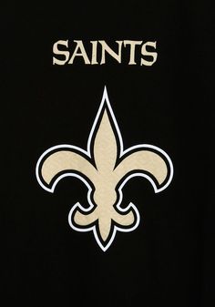 the new orleans saints logo on a black shirt