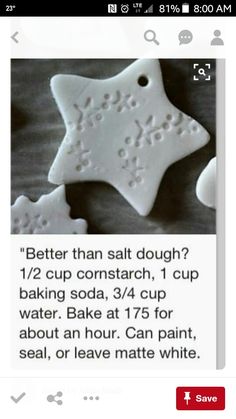 an image of some white cookies with words written on the top and bottom one has a star shaped cookie