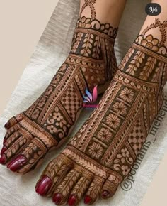 the feet are decorated with henna designs