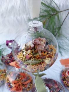 a glass ornament filled with dried flowers