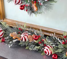 a christmas garland with candy canes and ornaments