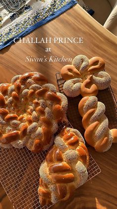 there are many different types of breads on the cooling rack and in front of them