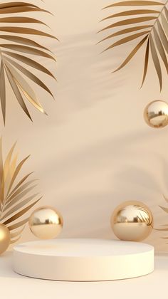 gold balls and palm leaves on a white pedestal in front of a beige wall with a backdrop