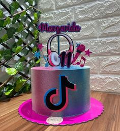 a birthday cake with the number one on it and music notes, stars, and musical instruments