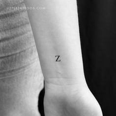 a small z tattoo on the wrist