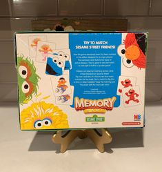 the sesame street memory game sits on a stand