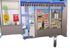 an image of a store front with no parking signs on the windows and in japanese writing