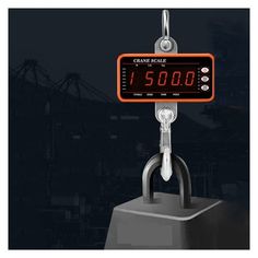 the crane scale is on display in front of a black background with an orange frame