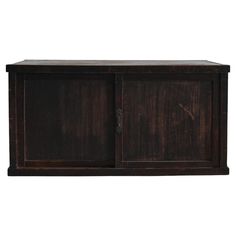 an old wooden cabinet with two doors