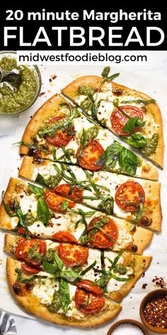 a flatbread pizza topped with tomatoes, basil and mozzarella sauce on top