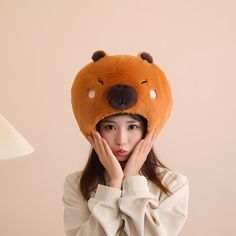 Description Stay cozy and cute with our Capybara Plush Hat! Perfect for adding a touch of kawaii charm to your outfit, this ultra-soft and comfy hat is great for cold days or just making a playful statement. Ideal for gifting or treating yourself to something irresistibly adorable! Features: 🛍 100% premium quality cotton. 🎉 Perfect for all ages. 🎁 Perfect for a gift on any special day or holiday. 🛌 Promotes relaxation with its soft and huge material. 🧵 Material is PP cotton. 📏 Heights available 35cm x 33cm/13.78" x 12.99" (Approx.) Plush toy is vacuum packed, so it may be flat. After unpacking, you can put it in a warm and dry environment and it will recover quickly. 🖥 Due to the difference between different monitors, the picture may not reflect the actual color of the item ⚠️ Warni