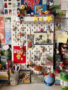 there are many items on the pegboard in this cluttered office space, including toys and magnets