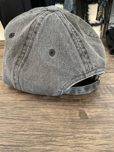 This Charcoal Denim Cap is the perfect addition to any wardrobe. With an adjustable back, it offers a comfortable fit for any size. The durable denim material ensures lasting quality, making it a great hat for everyday use. Casual Dark Wash Short Brim Hat, Casual Distressed Adjustable Baseball Cap, Trendy Washed Hats With Curved Bill, Trendy Washed Curved Bill Hats, Trendy Washed Snapback Hat, Distressed Medium Wash Adjustable Hat, Casual Washed Black Baseball Cap With Curved Bill, Gray Cotton Hat With Short Brim, Casual Washed Black Baseball Cap