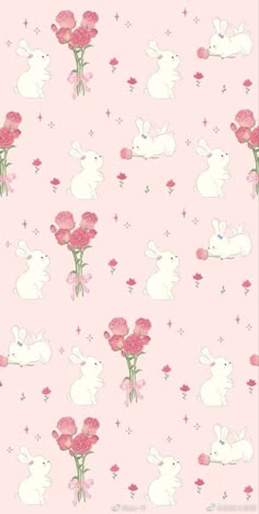 a pink background with white rabbits and flowers